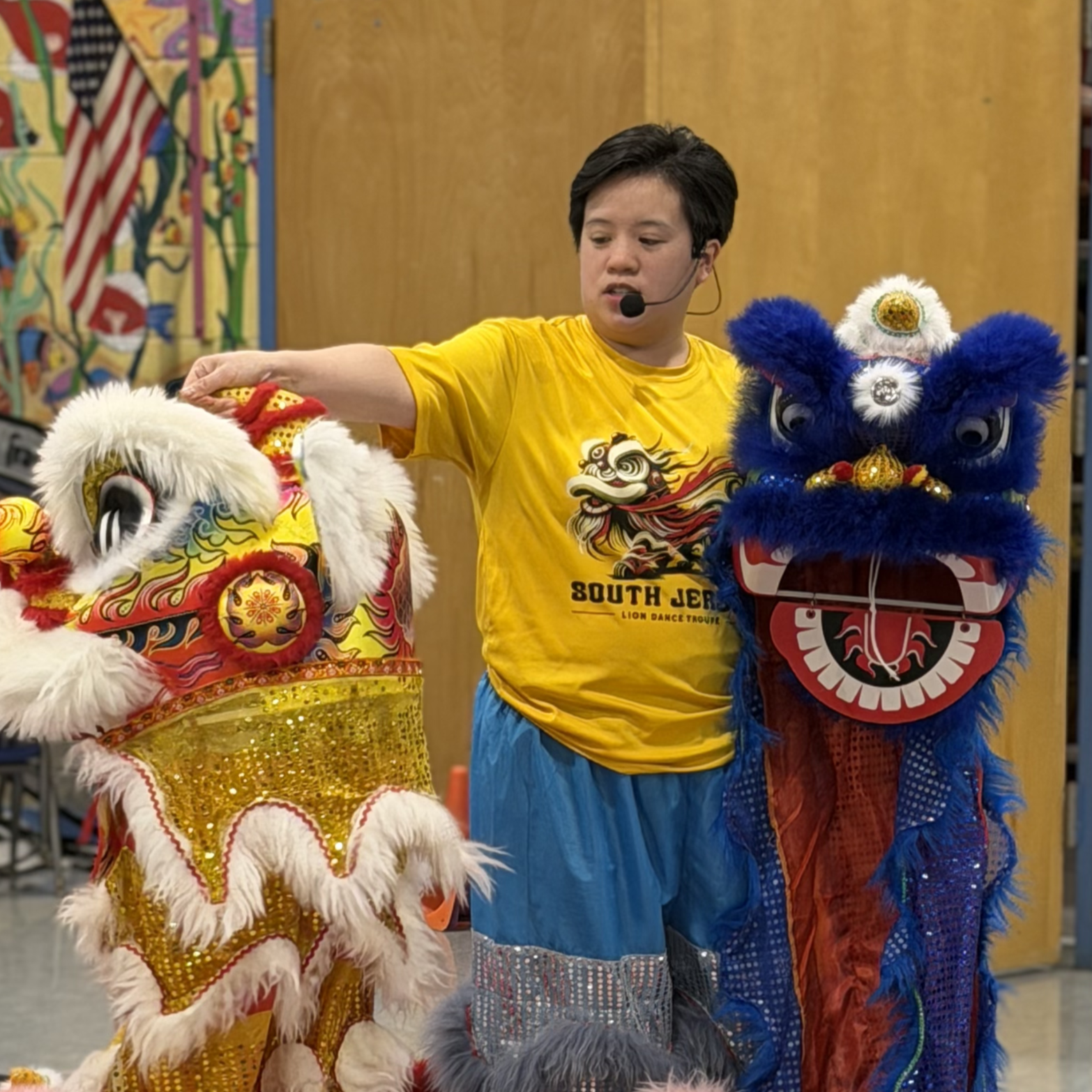 Coach Linh performing with a lion